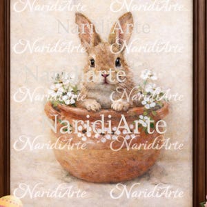 Pode incluir: Pintura emoldurada de um coelho marrom em um vaso de terracota com flores brancas. O texto "Naridi Arte" está presente. Ovos de Páscoa coloridos são visíveis no canto inferior esquerdo.
