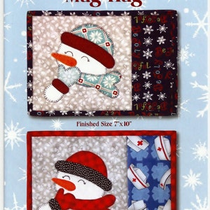 May include: A fabric mug rug with a snowman design. The snowman has a red hat and scarf, an orange carrot nose, and a smiling face. The finished size is 7" x 10". The text "Joyful Snowman Mug Rug" is at the top.