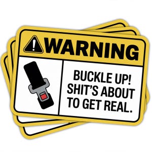 May include: A stack of yellow warning stickers with black text and a seatbelt graphic. The text reads "WARNING" at the top, and below it, "BUCKLE UP! SHIT'S ABOUT TO GET REAL."