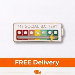 May include: A rectangular enamel pin with the text "MY SOCIAL BATTERY" above a battery level indicator. The indicator shows a range of emotions from sad to happy faces. A yellow lightning bolt is on the right side.