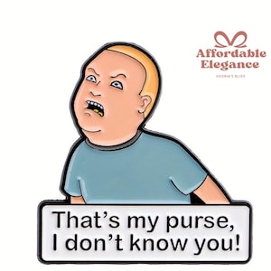 Puede incluir: Pin con un personaje de dibujos animados con pelo rubio y camisa azul, mostrando enfado. El texto "That's my purse, I don't know you!" está en un rectángulo blanco. Borde negro, fondo blanco.