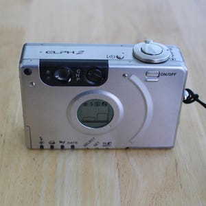 Canon ELPH 2 / Ixus II APS Film Camera – 23mm Lens – Flash – Strap & Manual – Untested – 1990s