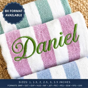 May include: Three folded terry cloth towels featuring vertical stripes in mint green, lavender, and light blue against a white background. The lavender towel is embroidered with the name Daniel in green cursive script. Text reads BX FORMAT AVAILABLE.