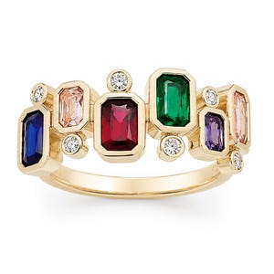 May include: A gold ring featuring a series of multi-colored, emerald-cut gemstones including blue, pink, red, green, and purple stones, accented by small, round, clear white diamonds set in a staggered, bezel-style arrangement along the band.