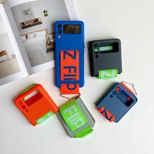 Luxury Wristband Case for Samsung Galaxy Z Flip 7 6 5 4 3 | Shockproof Hard Cover with Hand Strap