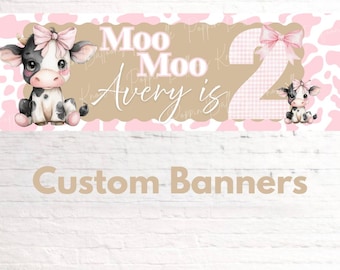 May include: A custom banner with a pink and white cow print background. The banner features the text "Moo Moo Avery is 2" with a cartoon cow illustration and a pink bow. The words "Custom Banners" are at the bottom.