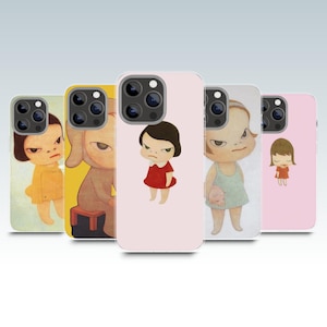 May include: A collection of five phone cases featuring illustrations of cartoon characters with stern expressions. The cases showcase different characters in various outfits, including a yellow dress, a red dress, and a green dress, against a light background.