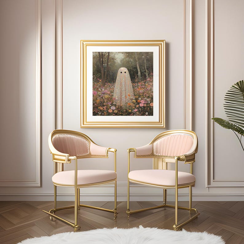 May include: A framed art print featuring a ghost figure in a field of flowers. The artwork is in a gold frame, hanging above two pink and gold chairs. The chairs have a curved back and armrests, with a plush seat. A white rug is on the floor.
