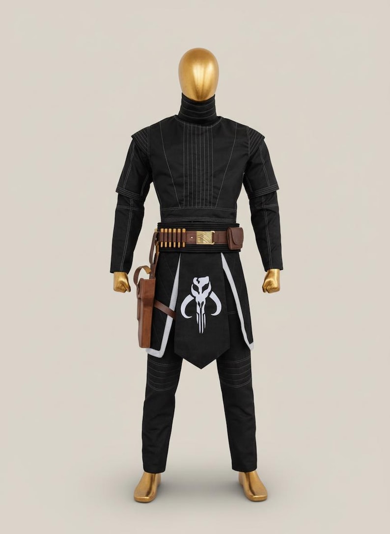May include: Black costume with white stitching, featuring a high collar and a distinctive emblem on the front. The outfit includes a brown belt with ammunition, a holster, and matching trousers. The mannequin has a gold head and feet.