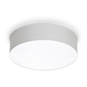 May include: A white, circular flush mount ceiling light fixture. The light has a cylindrical shade and a bright, flat, circular light source. The fixture is mounted flush against a white ceiling, creating a clean, modern aesthetic.