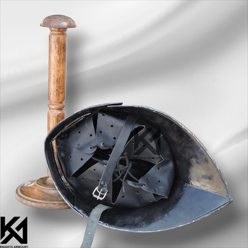 Authentic German Sallet Helmet made from 16-gauge mild steel. Provides battle-ready protection for SCA, LARP, Buhurt, and HMB enthusiasts. Polished and riveted for durability, with padded interior for comfort. Perfect for medieval reenactment, cosplay, stage performances, and collectors seeking realistic knight armor replicas.