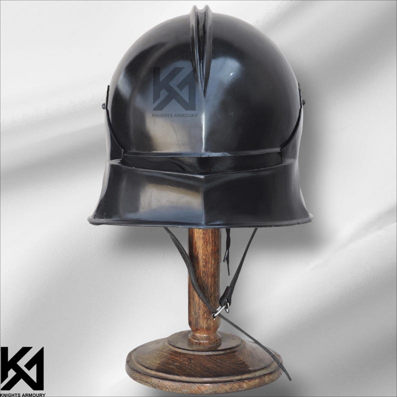 16G Mild Steel German Sallet Helmet crafted for medieval fighters and reenactors. Provides authentic knight aesthetics and protection for SCA, LARP, Buhurt, and HMB events. Features polished finish, padded interior, and riveted construction for durability and comfort. Ideal for display, cosplay, and collectors seeking realistic battle-ready medieval armor.