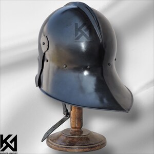 German Sallet Helmet made of 16-gauge mild steel for realistic medieval knight combat. Battle-ready design suitable for SCA, LARP, HMB, and Buhurt events. Padded interior ensures comfort, while polished riveted steel provides durability and authenticity. Perfect for reenactors, collectors, and cosplay warriors seeking historically accurate armor.