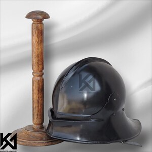 Hand-forged German Sallet Helmet in 16-gauge mild steel, combining historical accuracy with combat-ready durability. Full head protection with padded interior makes it perfect for SCA, LARP, HMB, and Buhurt use. Polished steel and riveted details give it authentic medieval knight appeal, suitable for collectors, cosplay, or reenactment enthusiasts.