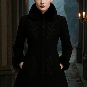 May include: A long black coat with a faux fur collar and cuffs. The coat features intricate embroidered floral designs and a button-down front. The woman in the image is wearing the coat in an outdoor setting.