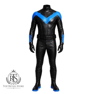 May include: A black full-body jumpsuit featuring a high collar, long sleeves, and a prominent blue chevron emblem across the chest and shoulders. The suit includes matching black gloves, a utility belt, and black boots with blue soles.