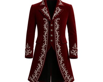 May include: A burgundy velvet coat with ornate white embroidery. The coat features a notched collar, decorative buttons, and a long, tailored design. The embroidery is detailed along the front, collar, and cuffs, creating a formal aesthetic.
