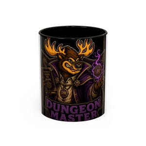 May include: Black ceramic mug featuring a cartoon moose character in a purple robe, holding a glowing purple die. The mug has the words "Dungeon Master" and "The World is Yours to Shape" printed on it. A fun gift for tabletop gamers.