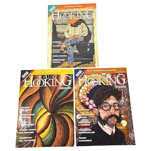 May include: Three issues of "Rug Hooking" magazine are displayed. The covers feature colorful illustrations, including a cowboy, a gingerbread mat design, and a steampunk-inspired portrait. The magazines celebrate rug hooking.