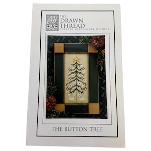 May include: A white card with the text "The Drawn Thread" and "The Button Tree". The card features a framed needlework design of a Christmas tree with a gold star on top, white ornaments, and two birds at the base.