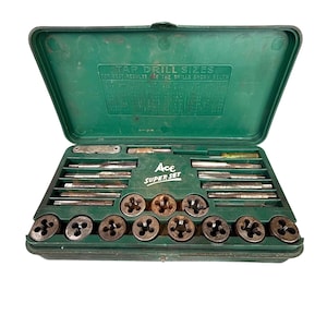 May include: An open green plastic case containing a tap and die set. The set includes various metal taps, dies, and tools, with the text "TAP DRILL SIZES" and "Ace SUPER SET" visible on the case.