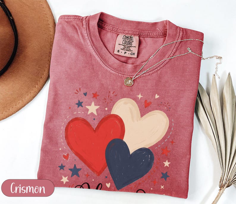 Red, white, and blue heart graphic t-shirt with stars and "Crismon".