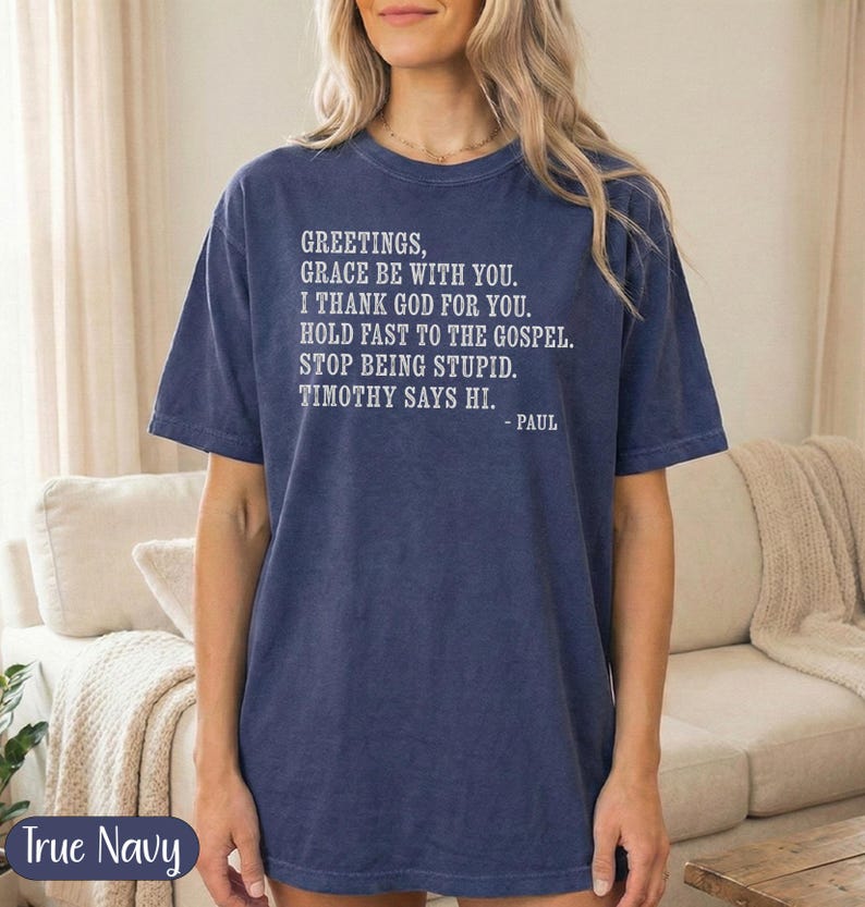 Navy t-shirt with "Greetings, Grace Be With You..." scripture from Paul.