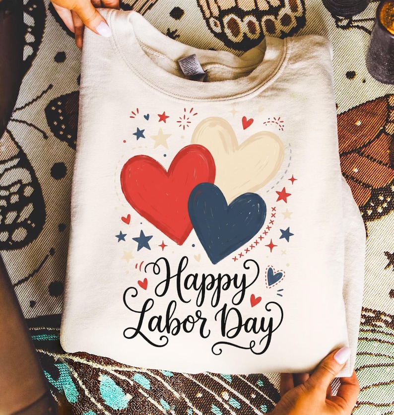 Cream sweatshirt with red, white, and blue hearts and "Happy Labor Day" text.