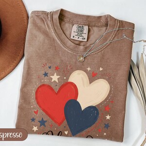 Brown t-shirt with hearts and stars, "Espresso" label.