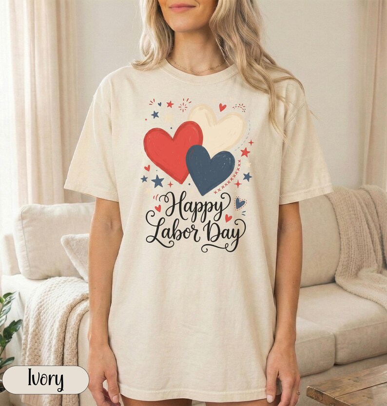Cream t-shirt with "Happy Labor Day" and red, white, and blue hearts.