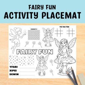 May include: A black and white activity placemat with the text "FAIRY FUN ACTIVITY PLACEMAT". The placemat features illustrations of fairies, connect four, tic-tac-toe, and other activities. Two pencils are on the right side.