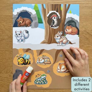 Puede incluir: Una colorida hoja de actividades con ilustraciones de animales, como un oso, un conejo y una abeja. La hoja incluye el texto "Includes 2 different activities" y un tubo de pegamento líquido.