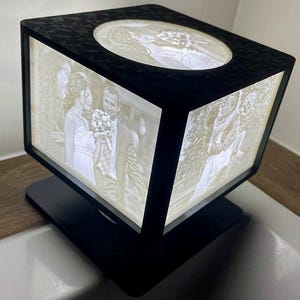 Personalized nightlight with five 3D printed photos (lithophanes).