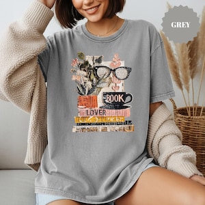 May include: A white ceramic mug with a black handle and the text "But First, Coffee" in a handwritten style. The mug is on a white surface. The mug is 4 inches tall.