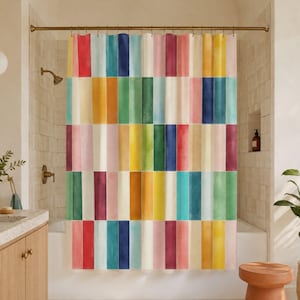 May include: A shower curtain featuring a repeating vertical pattern of rectangular blocks in various colors including red, orange, yellow, green, blue, and pink. The design has a watercolor-like texture with soft color gradients within each block.