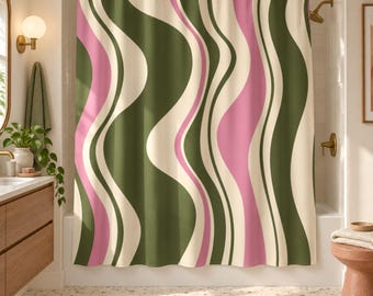 May include: A shower curtain featuring a repeating vertical pattern of wavy, flowing stripes in shades of olive green, soft cream, and muted pink. The fabric hangs from a gold-toned rod with circular rings, displaying a continuous, rhythmic design.