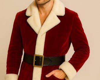 May include: A red velvet jacket with cream-colored faux fur trim, cuffs, and lapels. The jacket features a black belt with a gold buckle. A pocket is visible on the right side. The jacket is part of a Santa Claus costume.