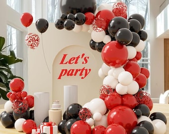 May include: A festive party scene with red, black, and white balloons, including confetti-filled balloons. The words "Let's party" are displayed on a cream-colored backdrop. Several small gift boxes and decorative pillars are also present.