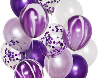 May include: A cluster of purple, lavender, and white balloons. Some balloons are solid colors, while others have a marbled design or are filled with purple confetti. The balloons are tied together with white string, creating a festive arrangement.