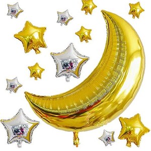 May include: A golden crescent moon balloon and star-shaped balloons in gold and silver against a white background. The balloons are inflated and ready for a party or celebration. The arrangement evokes a celestial theme.