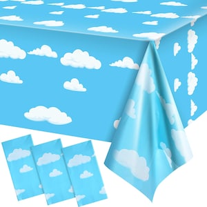 May include: A rectangular plastic tablecloth featuring a repeating pattern of white fluffy clouds against a bright sky blue background. The tablecloth is draped to show its texture and design, accompanied by three folded rectangular pieces of the same material.