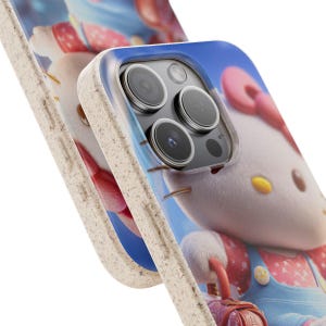 Op de afbeelding: Close-up van twee telefoonhoesjes met een cartoonkarakterontwerp. De hoesjes hebben een lichtgekleurde, getextureerde rand en een kleurrijke afbeelding van een personage met een rode strik, overall en een kleine tas. De achtergrond is helderblauw.