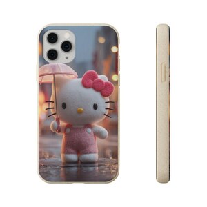 May include: A phone case with a 3D rendering of Hello Kitty holding a pink umbrella. The case has a light beige border and a blurred city scene background with bokeh lights. Hello Kitty wears a pink outfit and a pink bow.