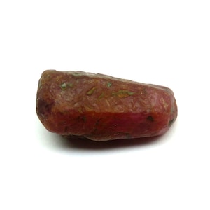 May include: A white ceramic mug with a black handle and the text "But First, Coffee" in a bold, black font. The mug is sitting on a wooden surface. The mug is approximately 4 inches tall.