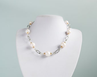 Large and lustrous white freshwater pearl necklace with gold and silver