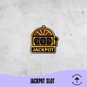 May include: A gold-colored slot machine charm with the word "JACKPOT" at the bottom. The slot machine displays three sevens. The text "JACKPOT SLOT" is at the bottom of the image.