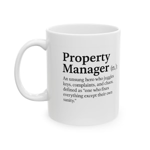 May include: White ceramic mug featuring the words "Property Manager" in black, accompanied by a definition. The definition describes a property manager as an unsung hero who juggles keys, complaints, and chaos.