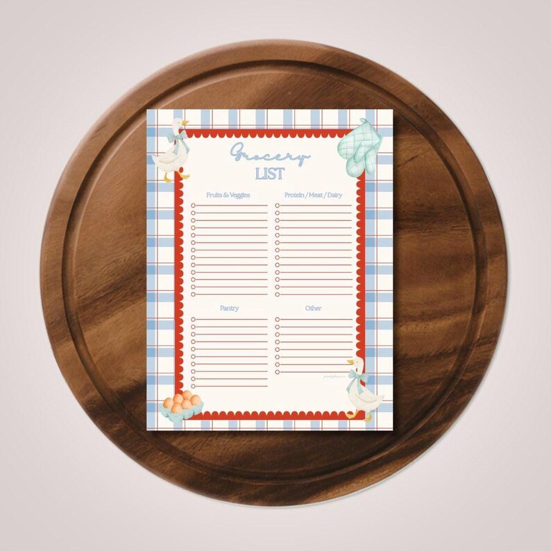 May include: A rectangular grocery list notepad featuring a blue and white plaid border, a red scalloped edge, and illustrations of two white geese, a light blue oven mitt, and a carton of eggs. The text reads Grocery LIST with four columns.