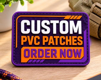 May include: A rectangular PVC patch with a dark purple background and a hexagonal texture. The patch features the white text CUSTOM, the orange text PVC PATCHES, and the purple text ORDER NOW on an orange background with purple accents.