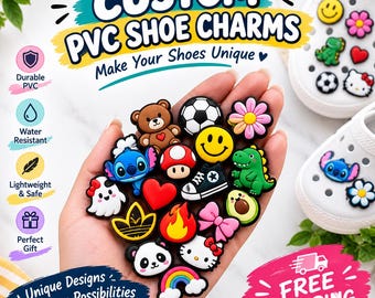 May include: A collection of colorful PVC shoe charms featuring various icons including a teddy bear, soccer ball, flower, smiley face, dinosaur, heart, sneaker, ghost, avocado, panda, and rainbow, held in a palm with white clogs nearby.
